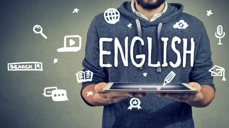 Ilustración de una persona con una computadora y la palabra English.
